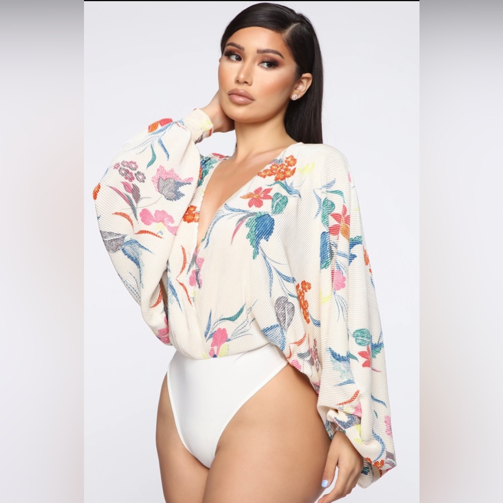 Floral body suit with neck plunge.